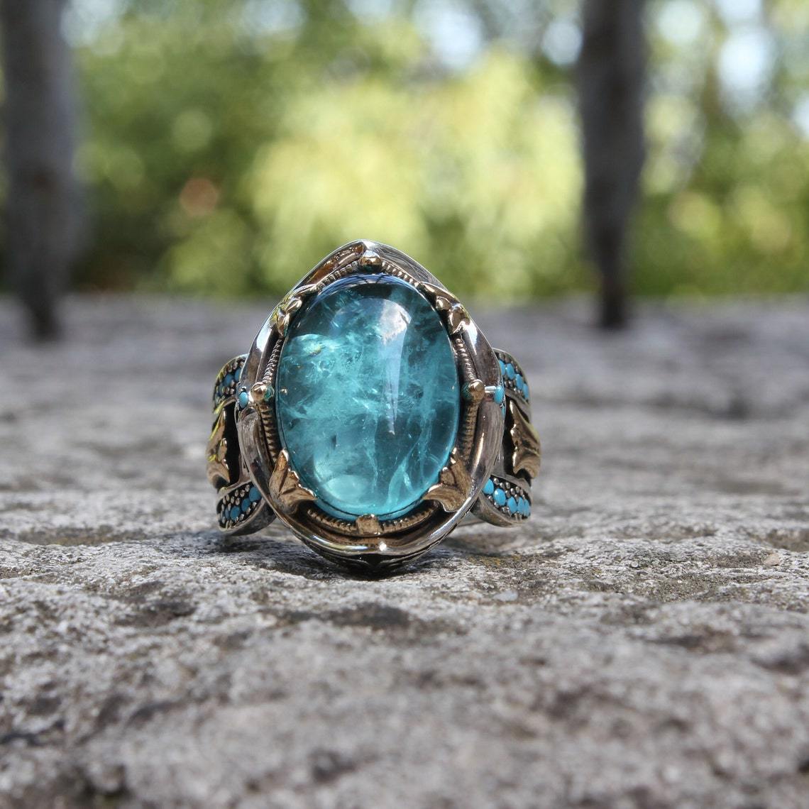 Engraved blue gemstone ring