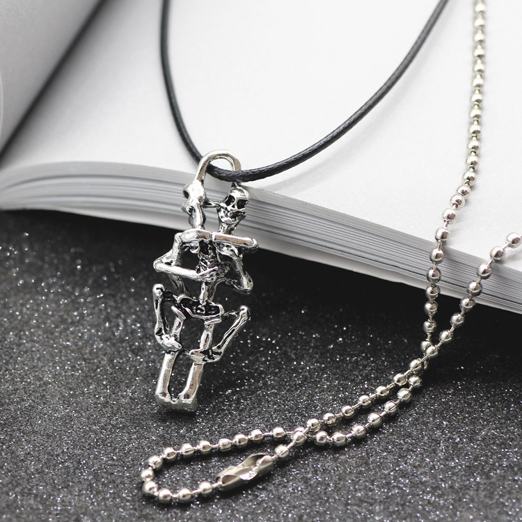 Embracing Lovers Skull Necklace