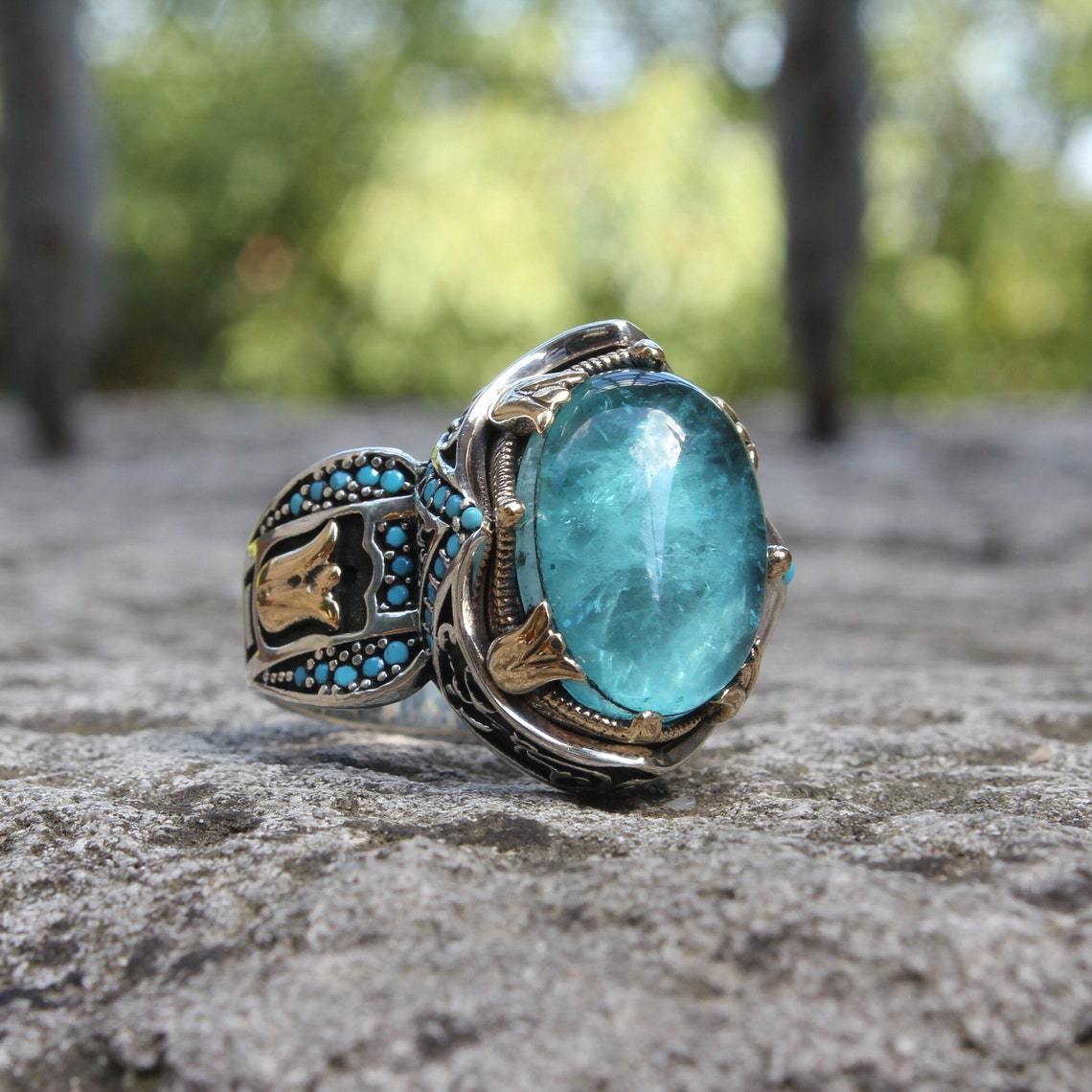 Engraved blue gemstone ring